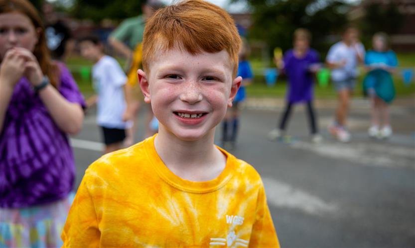 A boy smiles